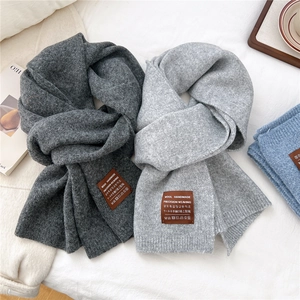 Thick handmade wool knitted scarves in grey tones with premium leather tag for winter warmth