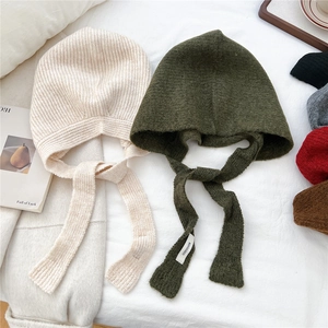 Winter knitted earflap beanie with long drawstring, solid color warm headwear for women