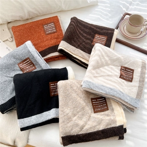 Thick wool blend knitted scarf with contrast trim and leather patch in six colors