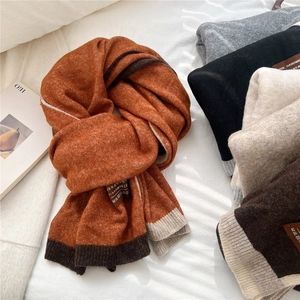 Knitted two-tone scarf for winter with soft wool texture and minimalist color block design