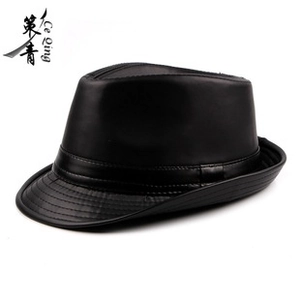 Close-up of the smooth black leather texture and stitched band on this classic fedora hat