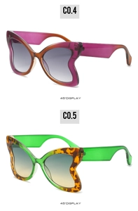 Detailed 45-degree view of leopard print and gradient butterfly oversized sunglasses