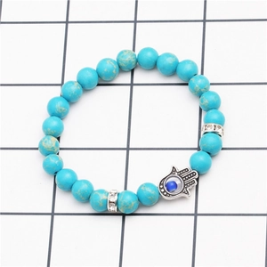 Bohemian turquoise beaded stretch bracelet with Hand of Fatima charm and evil eye detail