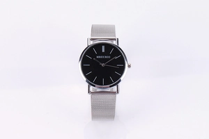 Detail of silver Milanese mesh strap and minimalist black dial of the men's quartz watch