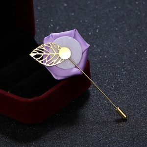 Detail of lavender satin rose brooch with gold hollowed leaf on long stick pin