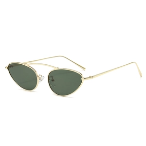 Cat eye metal sunglasses with gold frame and dark green lenses in a frontal view