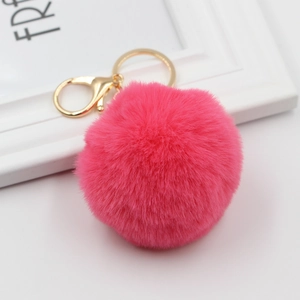 Vibrant rose red faux rabbit fur pompom keychain with golden metal ring and lobster clasp