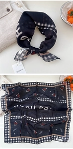 Detail view of square cotton scarf with paisley pattern, stars and plaid edge trim