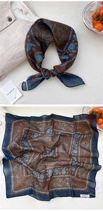 Detail showing square paisley scarf with blue patterns on brown linen fabric