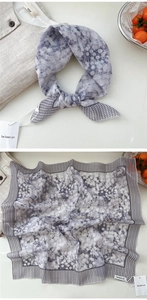 Detailed pattern view of a gray and white polka dot floral square scarf in soft linen