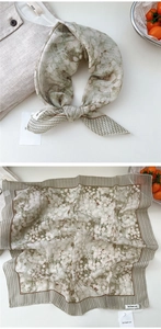Detail view of cotton linen square scarf featuring floral prints and vintage borders