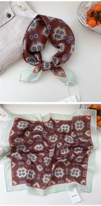 Close-up of geometric pattern silk scarf with burgundy and green color contrast