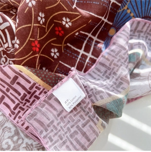 Detail of floral printed neck scarf made of soft cotton and polyester blend fabric