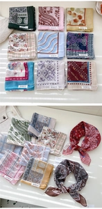Macro detail of various floral and paisley cotton linen scarves with fine edge stitching