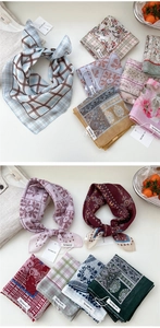 Close-up of floral cotton linen square scarves with vintage patterns and brand tags
