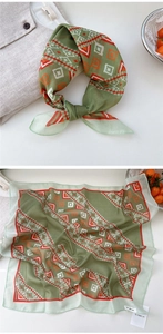 Detail of vintage green geometric pattern scarf tied on a linen shirt neck for styling
