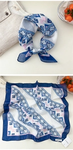 Detail of soft cotton linen square scarf with blue and pink geometric ethnic pattern