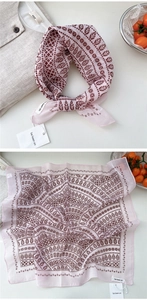 Detail of soft cotton linen neckerchief with pink and brown paisley leaf patterns