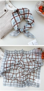 Detail of vintage brown and blue plaid cotton linen scarf with soft breathable texture