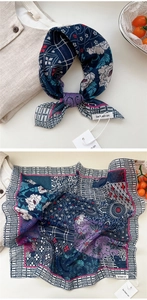 Detailed view of floral cotton linen square scarf with blue purple print and rolled edges