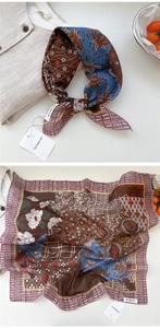 Detail of floral cotton linen neck scarf with vintage print and soft texture