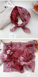 Detailed close-up of floral print cotton linen scarf with vintage pattern and fine stitching