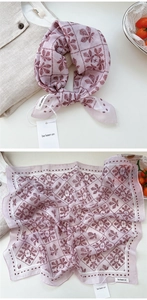Detail view showing floral cotton linen scarf texture and plum leaf print patterns