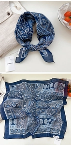 Detailed blue Paisley pattern on lightweight neck scarf with soft cotton linen texture