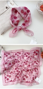 Detail view of pink floral cotton linen scarf showing soft texture and artistic dot pattern