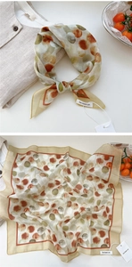 Detail of floral polka dot square scarf with premium texture and earthy tones print