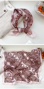 Detail view of pink and brown paisley floral cotton linen scarf with soft texture