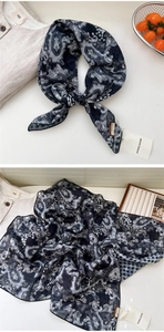 Detail of paisley pattern cotton linen scarf with tag in a natural aesthetic setting