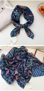 Detail of navy paisley cotton linen scarf with fine rolled edges and vintage floral pattern
