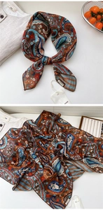 Detail shot of vintage paisley cotton-linen scarf with fine edge stitching and brand tag