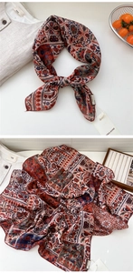 Detailed macro view of bohemian floral cotton linen scarf with vintage paisley patterns