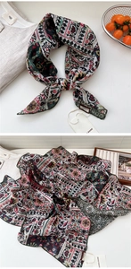 Close-up of vintage paisley pattern on a soft cotton linen scarf with woven brand label