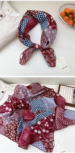 Detailed close-up of retro paisley linen cotton scarf with fine rolled edges in reddish brown