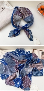 Detail of vintage paisley cotton-linen scarf with floral prints and silk texture