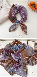 Detail of paisley cotton linen scarf with vintage floral print and smooth silk-like texture