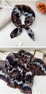 Detailed view of paisley leopard print cotton linen scarf with brand labels and texture