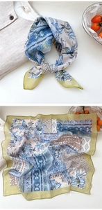 Close-up of floral cotton linen square scarf with blue and green geometric patterns