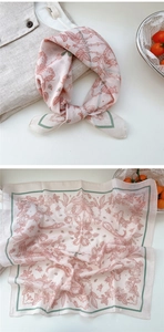 Detail view of cotton-linen floral scarf with pink roses and elegant green borders