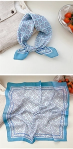 Detailed view of a blue floral linen-cotton neck scarf with vintage geometric patterns