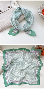 Detail of floral cotton linen square scarf with geometric pattern and soft texture