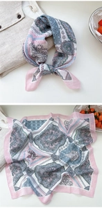 Detail of floral paisley cotton linen square scarf with pink and blue geometric patterns