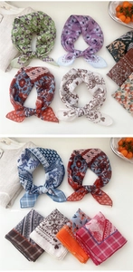 Detailed view of various colorful floral and paisley print cotton linen square neck scarves