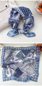 Detail of blue bohemian print linen square scarf with geometric borders and floral patterns