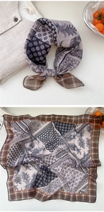 Detail of soft paisley and plaid cotton linen scarf for women used as a hair band