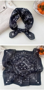 Detail of navy blue paisley cotton linen square scarf with heart patterns and floral texture
