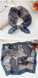 Detail of vintage paisley cotton linen scarf with intricate floral print and hemmed edges
